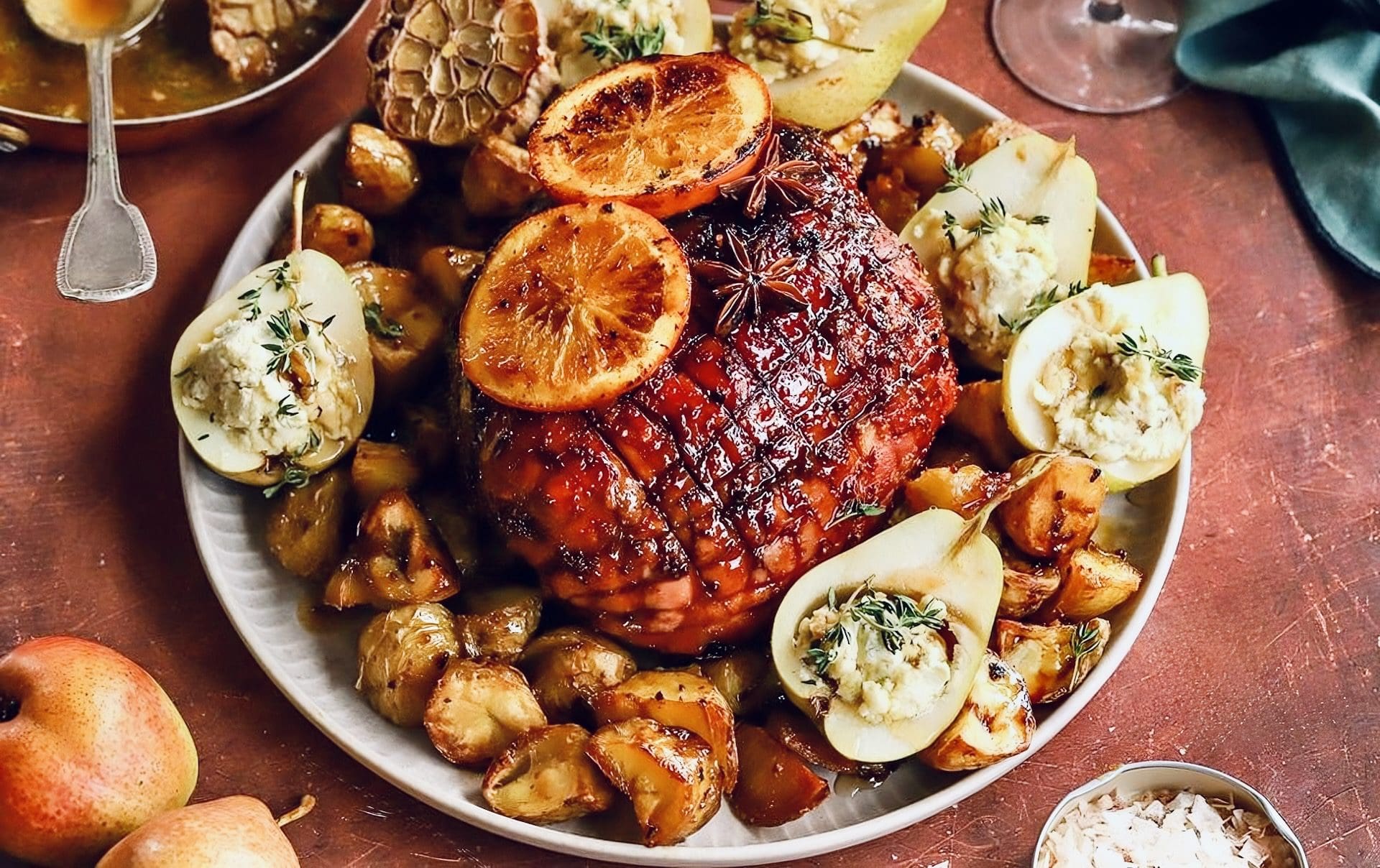 Gammon with citrus glaze, potato roasties and blue cheese pears